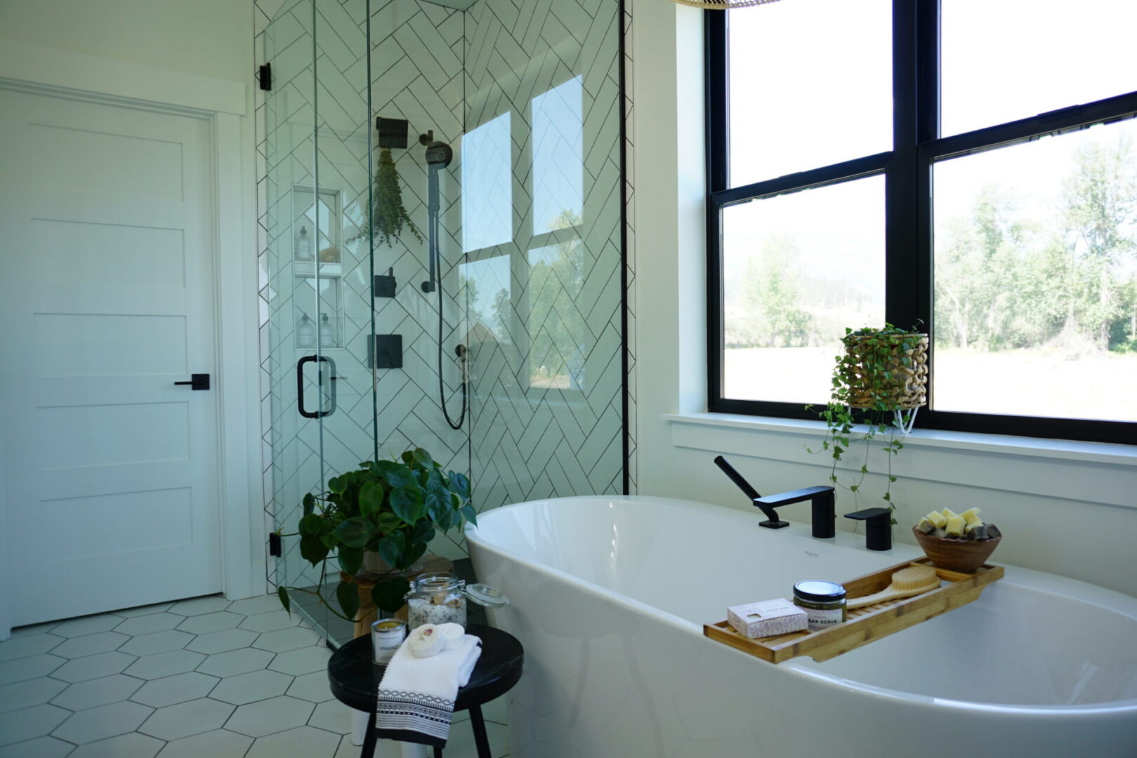 Modern bathroom with tub and glass shower.